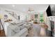 Spacious living room with hardwood floors, a fireplace, and comfortable seating, perfect for relaxation at 1622 Gates Nw Pl, Atlanta, GA 30318