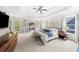Bright main bedroom boasting a tray ceiling, sitting area, and access to a private balcony at 1622 Gates Nw Pl, Atlanta, GA 30318