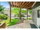 Inviting covered outdoor space with view of the neighborhood, landscaped greenery, and sidewalk at 1622 Gates Nw Pl, Atlanta, GA 30318