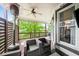 Cozy patio featuring an outdoor heater, stylish seating, and green surroundings through the wood screen at 1622 Gates Nw Pl, Atlanta, GA 30318