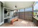 Inviting covered patio featuring comfortable seating, overhead lighting, and stylish wood screen at 1622 Gates Nw Pl, Atlanta, GA 30318