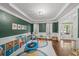 Spacious play room features hardwood floors, colorful decor, and ample natural light at 1622 Gates Nw Pl, Atlanta, GA 30318