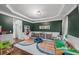 Play room features hardwood floors, colorful decor, shelving and lots of toys at 1622 Gates Nw Pl, Atlanta, GA 30318