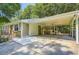 A covered carport offers ample parking, with an enclosed storage or workshop area at the rear at 8767 N View Dr, Lithia Springs, GA 30122