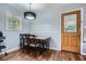 Charming kitchen dining area with a wooden table, light blue walls, and a window view at 8767 N View Dr, Lithia Springs, GA 30122