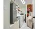 Functional laundry area with washer, dryer, and storage shelves; offers convenience and organization at 8767 N View Dr, Lithia Springs, GA 30122