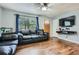 Cozy living room featuring hardwood floors, a large window, and stylish decor at 8767 N View Dr, Lithia Springs, GA 30122