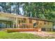 Cozy back patio area with grill, patio furniture, and partial enclosure, perfect for outdoor dining and relaxation at 8767 N View Dr, Lithia Springs, GA 30122