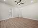 Bedroom featuring luxury vinyl plank flooring, natural light, ceiling fan, and a bathroom at 2335 Azalea Dr, Loganville, GA 30052