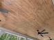 Detailed view of the stained tongue and groove wood ceiling and a ceiling fan on the covered patio at 2335 Azalea Dr, Loganville, GA 30052