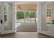 Back patio double doors open to a covered patio with views of the backyard at 2335 Azalea Dr, Loganville, GA 30052