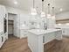 Chef's kitchen with a center island, stainless steel appliances, and modern finishes for cooking at 2335 Azalea Dr, Loganville, GA 30052