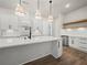 Gourmet kitchen features custom cabinetry, an island, and stainless steel appliances, perfect for cooking at 2335 Azalea Dr, Loganville, GA 30052