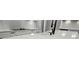 Detail of kitchen boasts sleek countertops, and modern fixtures for a stylish touch at 2335 Azalea Dr, Loganville, GA 30052
