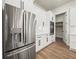 Modern kitchen equipped with stainless steel appliances and custom cabinets for ample storage at 2335 Azalea Dr, Loganville, GA 30052