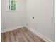Bright laundry room with modern flooring, utility hookups, and ample space at 2335 Azalea Dr, Loganville, GA 30052