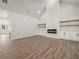Spacious living room with vaulted ceilings, a fireplace, and hardwood floors at 2335 Azalea Dr, Loganville, GA 30052