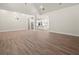 Open-concept living room featuring modern lighting and seamless access to the kitchen at 2335 Azalea Dr, Loganville, GA 30052