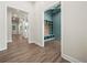View into the mud room with wood accents and a built-in shelving system for storage at 2335 Azalea Dr, Loganville, GA 30052