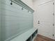 Inviting mudroom with built-in bench, storage cubbies, hooks, and a convenient entry door at 2335 Azalea Dr, Loganville, GA 30052