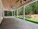Covered patio featuring a stained wood ceiling with ceiling fans and a view of the wooded backyard at 2335 Azalea Dr, Loganville, GA 30052