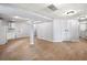 Large finished basement featuring light wood flooring and neutral paint with access to the utilities at 3078 Milford Chase Sw, Marietta, GA 30008