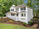 Charming two-story home with white siding, black shutters, and attached two car garage at 3078 Milford Chase Sw, Marietta, GA 30008