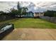 Spacious backyard with full lawn, mature landscaping, and privacy fence at 640 Dahoma Trl, Woodstock, GA 30188