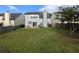 Spacious backyard featuring a well-maintained lawn, a patio area, and a fenced perimeter for privacy at 640 Dahoma Trl, Woodstock, GA 30188