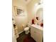Powder room with classic fixtures and wood floors at 640 Dahoma Trl, Woodstock, GA 30188