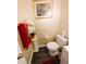 Powder room with classic fixtures and wood floors at 640 Dahoma Trl, Woodstock, GA 30188