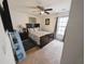 This bedroom features carpeted floors, a ceiling fan and large window letting in natural light at 640 Dahoma Trl, Woodstock, GA 30188