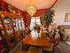 Dining room features a stunning chandelier and hardwood floors at 640 Dahoma Trl, Woodstock, GA 30188