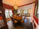 Elegant dining area featuring a chandelier, hardwood floors, and living room access at 640 Dahoma Trl, Woodstock, GA 30188