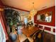 Beautiful formal dining room with dark wood floors, bright walls, and lots of natural light at 640 Dahoma Trl, Woodstock, GA 30188