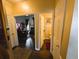 Hallway leading to bathroom and formal living room with dark wood flooring at 640 Dahoma Trl, Woodstock, GA 30188