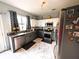 Kitchen featuring stainless appliances, white and gray cabinets and marble floors at 640 Dahoma Trl, Woodstock, GA 30188