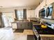 Updated kitchen with stainless appliances, granite counters, and access to the backyard at 640 Dahoma Trl, Woodstock, GA 30188