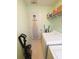This laundry room has an ironing board, washer, dryer, vacuum, and wire shelf at 640 Dahoma Trl, Woodstock, GA 30188
