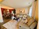 Comfortable living room featuring a large sectional sofa and view into dining room at 640 Dahoma Trl, Woodstock, GA 30188
