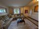 Comfortable living room with sectional sofa and neutral decor and plenty of light at 640 Dahoma Trl, Woodstock, GA 30188