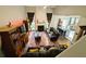 Open-concept living room featuring a fireplace, ceiling fan, and access to the kitchen at 640 Dahoma Trl, Woodstock, GA 30188