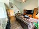 Inviting living room boasts soaring ceilings, wood floors, and a comfortable leather sofa set at 640 Dahoma Trl, Woodstock, GA 30188