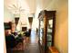 Spacious living room with fireplace, ceiling fan, hardwood floors, and display cabinet at 640 Dahoma Trl, Woodstock, GA 30188