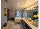 This bathroom boasts a soaking tub, double sinks, and elegant decorative accents at 640 Dahoma Trl, Woodstock, GA 30188