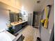 This bathroom features double sinks, a bathtub, a separate shower, and modern fixtures at 640 Dahoma Trl, Woodstock, GA 30188