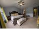 Comfortable main bedroom with plush carpeting and decorative pillows on the king-size bed at 640 Dahoma Trl, Woodstock, GA 30188