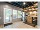 Unique bar area with rustic shelving, stainless steel refrigerator, and barrel accents at 150 Seals Rd, Dallas, GA 30157