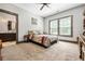 Comfortable bedroom features a ceiling fan and large window, creating a relaxing space at 150 Seals Rd, Dallas, GA 30157