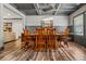 Elegant dining room featuring a coffered ceiling, modern chandelier, and hardwood floors at 150 Seals Rd, Dallas, GA 30157
